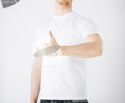 Image of man showing thumbs up