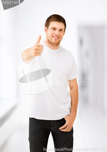 Image of man showing thumbs up