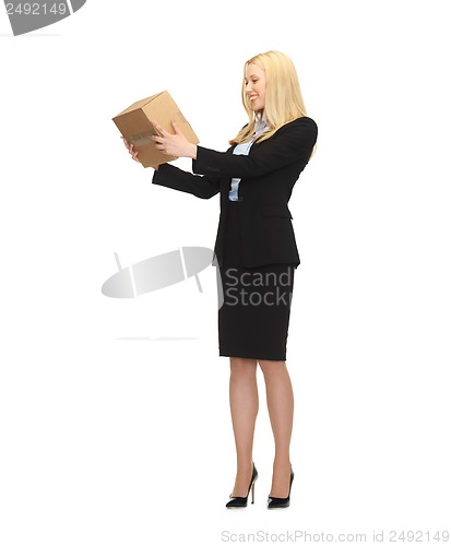 Image of attractive businesswoman holding cardboard box