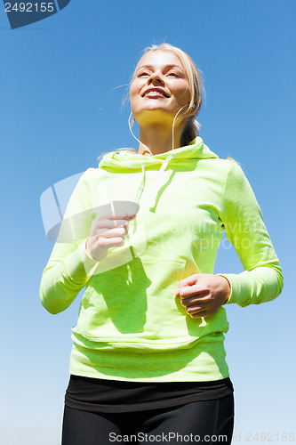 Image of woman doing running outdoors