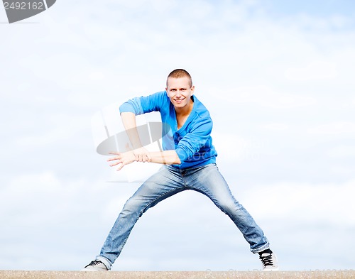 Image of handsome boy making dance move