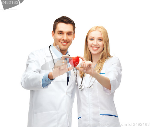 Image of doctors cardiologists with heart