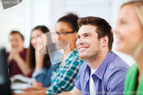 Image of students with computers studying at school