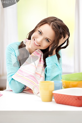 Image of lovely housewife at the kitchen