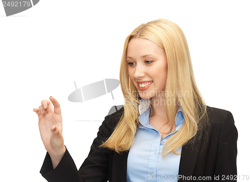 Image of businesswoman working with something imaginary