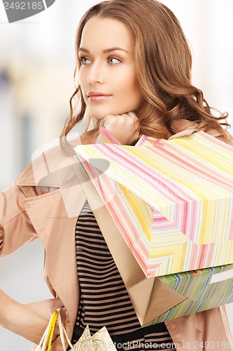 Image of woman with shopping bags in ctiy