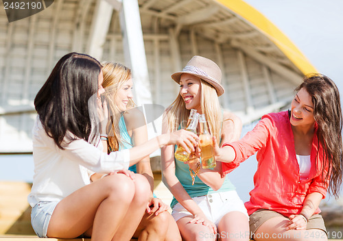 Image of girls with drinks on the beach