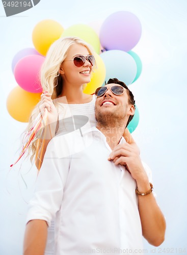 Image of couple with colorful balloons