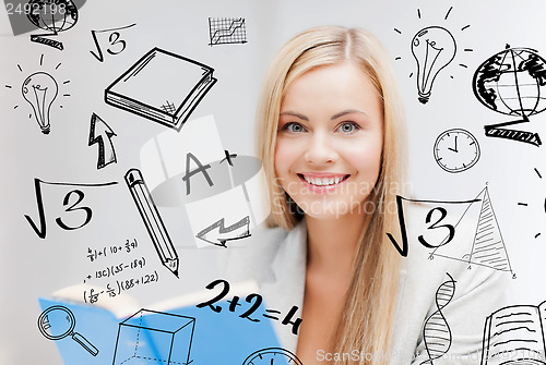 Image of student with doodles reading book