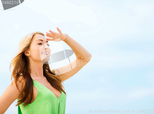 Image of girl looking for direction on the beach