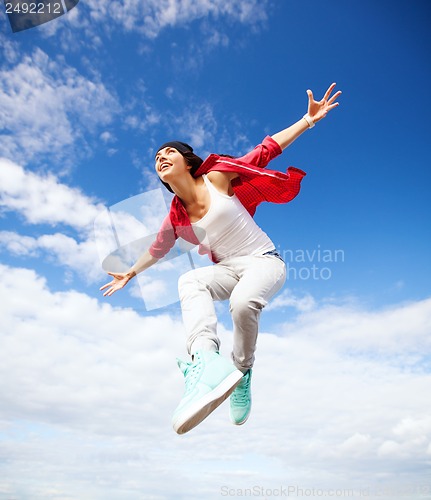 Image of beautiful dancing girl jumping