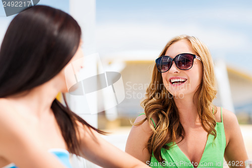 Image of girl in shades in cafe on the beach