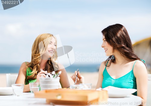 Image of girls in cafe on the beach