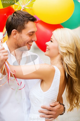 Image of couple with colorful balloons