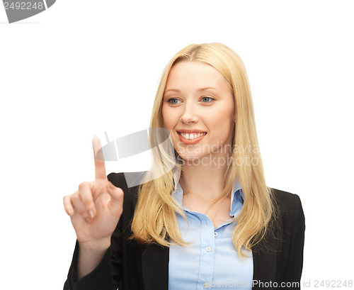 Image of businesswoman working with something imaginary