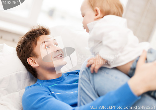 Image of happy father with adorable baby