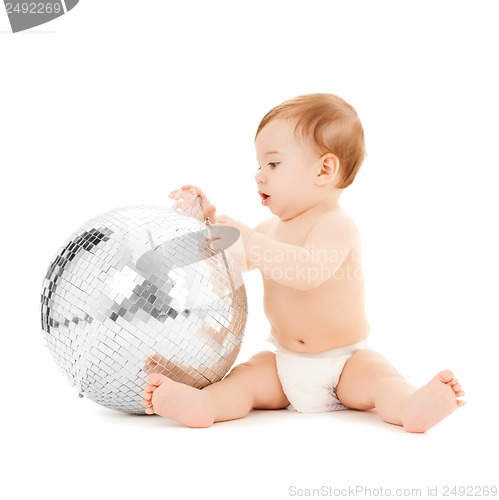 Image of child playing with disco ball