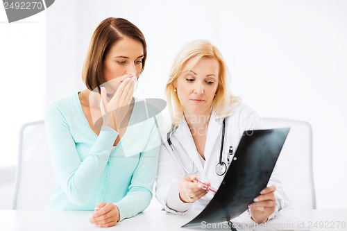 Image of doctor with patient looking at x-ray