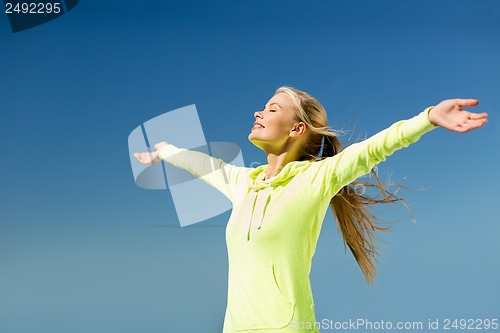 Image of woman doing sports outdoors