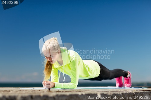 Image of woman doing sports outdoors