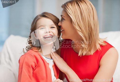 Image of mother and daughter cuddling