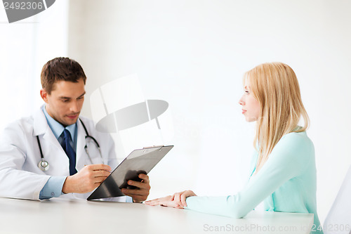 Image of doctor with patient in hospital