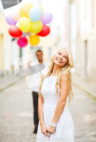 Image of couple with colorful balloons