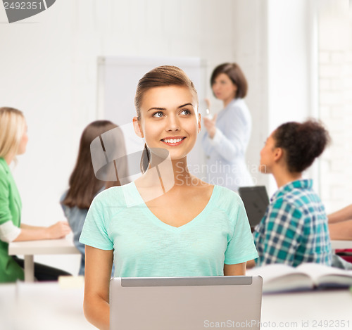 Image of student with laptop at school