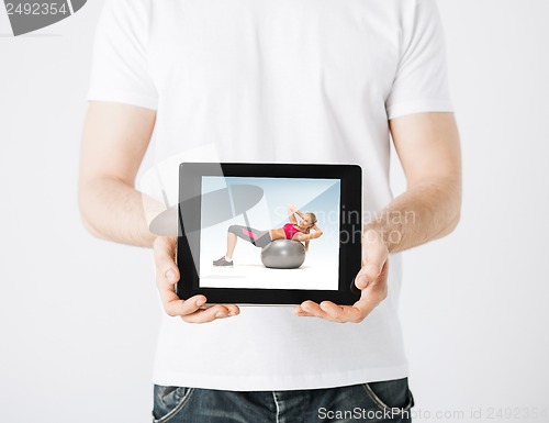 Image of man with tablet pc and sporty woman