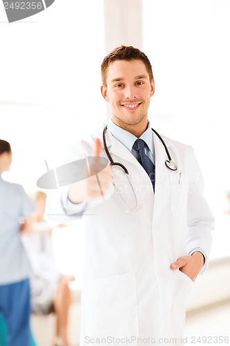 Image of doctor with stethoscope showing thumbs up