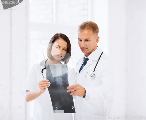 Image of two doctors looking at x-ray