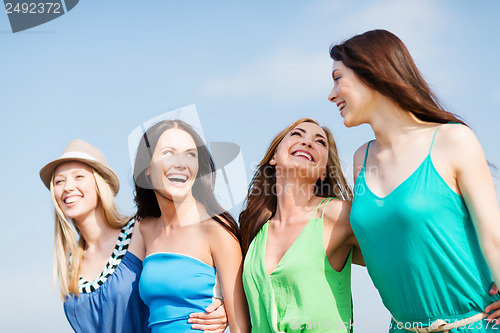 Image of girls walking on the beach