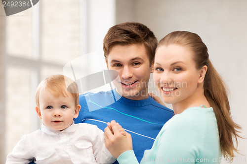 Image of happy family with adorable baby