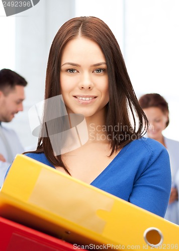 Image of woman with folders in office