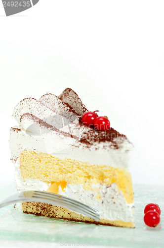 Image of whipped cream and ribes dessert cake slice