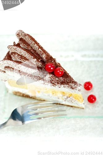 Image of whipped cream and ribes dessert cake slice