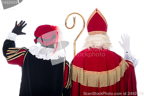 Image of Sinterklaas and Black Pete from the back