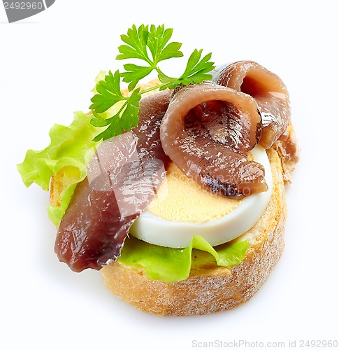 Image of sandwich with anchovy and egg