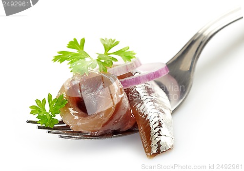 Image of fork with anchovy roll