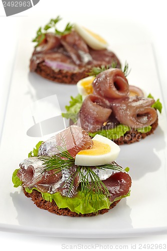 Image of canapes with anchovies and egg