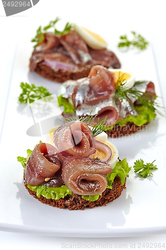 Image of canapes with anchovies and egg