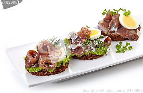 Image of canapes with anchovies and egg