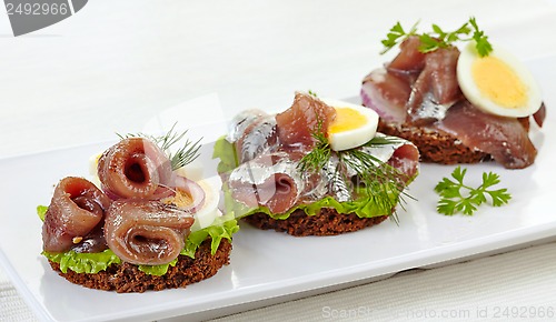 Image of canapes with anchovies and egg