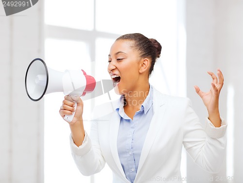 Image of strict businesswoman shouting in megaphone