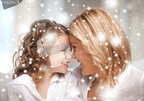 Image of mother and daughter cuddling