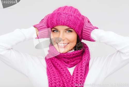 Image of woman in hat, muffler and mittens