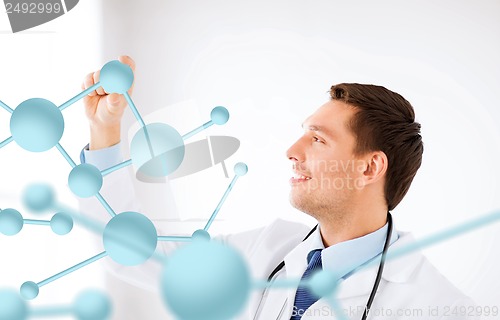 Image of young doctor with molecules