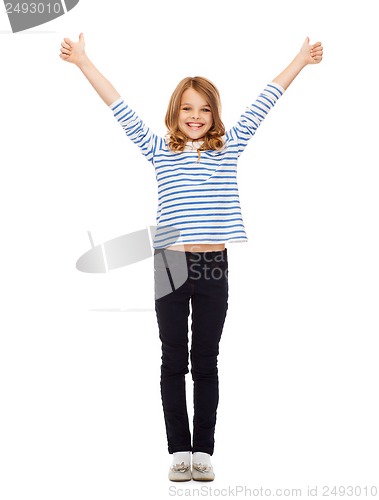Image of cute little girl showing thumbs up