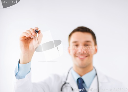 Image of doctor writing something in the air