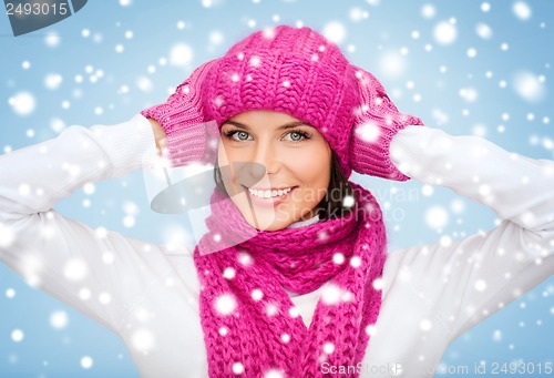 Image of woman in hat, muffler and mittens